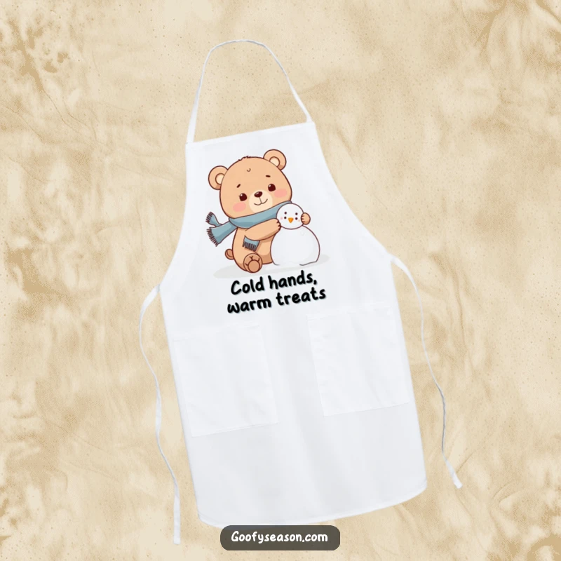 Funny bear character wearing a scarf, joyfully building a snowman on a kitchen apron, winter humor.