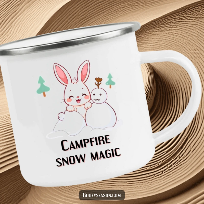 Funny Kawaii bunny camping mug showing a cute character with a mischievous grin building a snowman, ideal for outdoors.