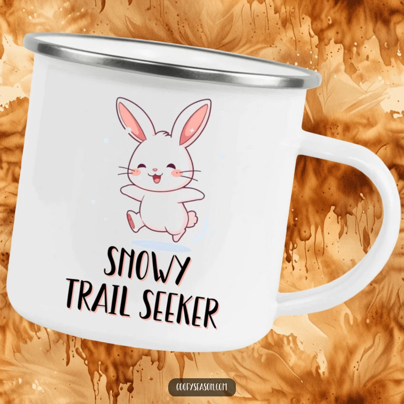 Funny camping mug featuring an energetic rabbit character chasing snowflakes, perfect for humorous outdoor sipping in winter.