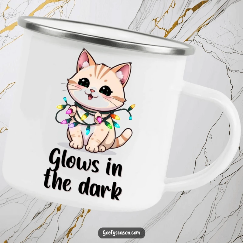 Funny enamel camping mug with an energetic cat blinking playfully, wrapped in holiday Christmas lights.