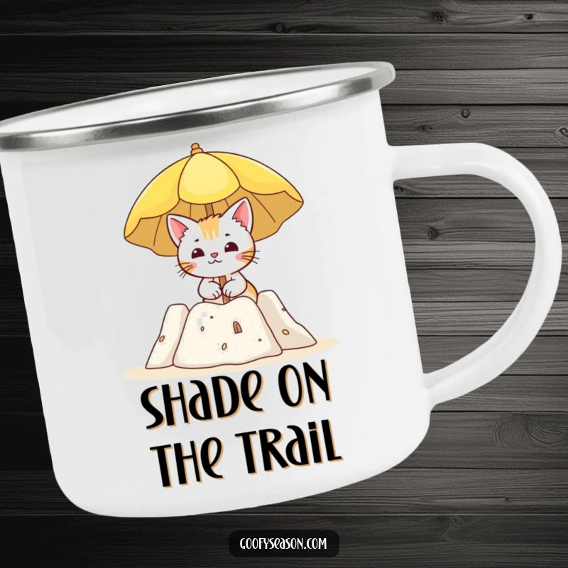 Funny camping mug with a curious cat character holding a sun umbrella by a sandcastle, ideal for beach trips.