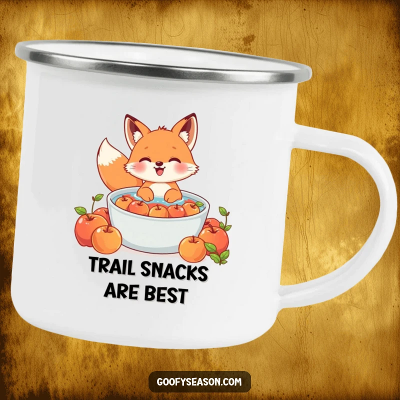Funny Kawaii fox camping mug showing a cute character gleefully bobbing for apples in a large tub, ideal for outdoors.