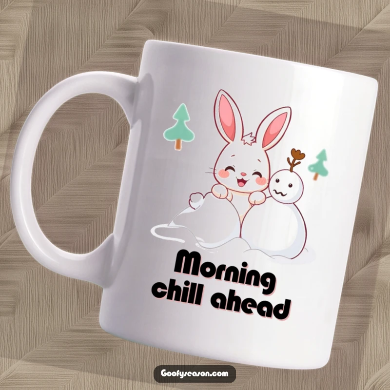 Funny Kawaii bunny mug showing a cute character with a mischievous grin attempting to build a snowman, winter fun.
