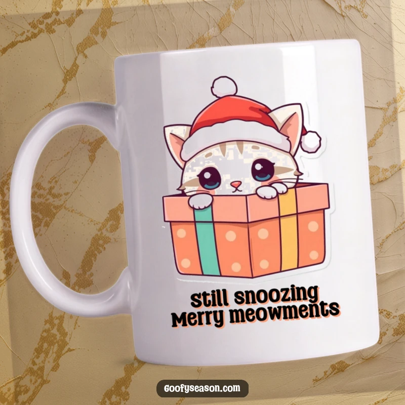 Funny cat mug with a curious cat wearing a Santa hat, peeking from a colorful present box, ready for Christmas cheer.