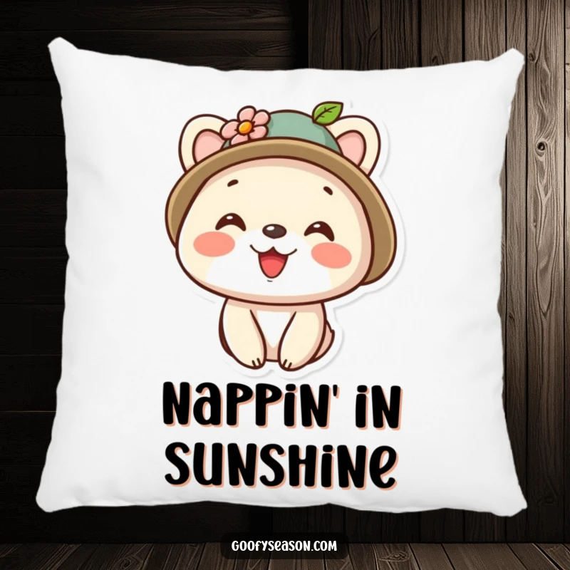 Funny kawaii animal character sporting a tiny hat adorned with a flower and a wide, happy smile on a decorative pillow.