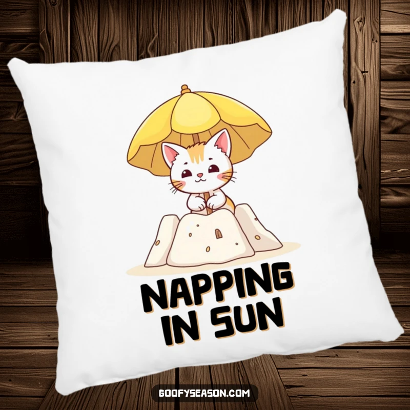 Funny decorative pillow with a curious cat character holding a sun umbrella near a sandcastle, embodying beach relaxation.