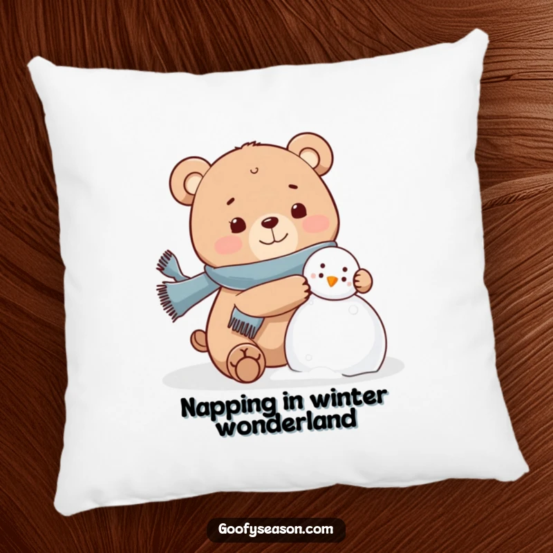 Funny bear wearing a scarf, happily building a snowman on a decorative pillow, winter theme.