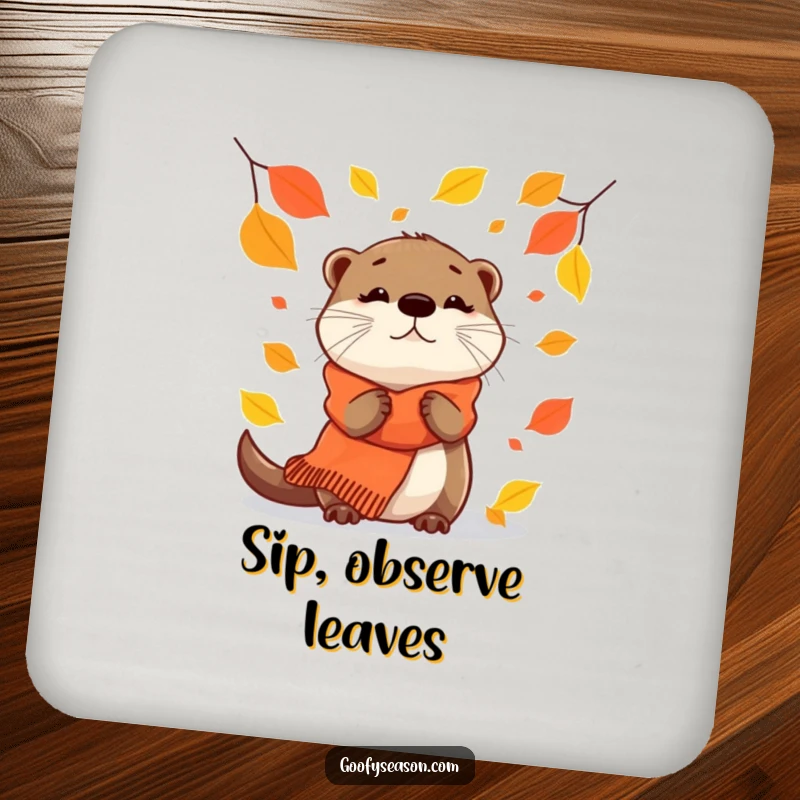 Funny Coaster: A curious otter in a scarf watches autumn leaves gently fall.