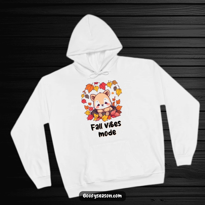 Funny hoodie design featuring a content animal character relaxing amongst beautiful, colorful falling leaves in a forest setting.