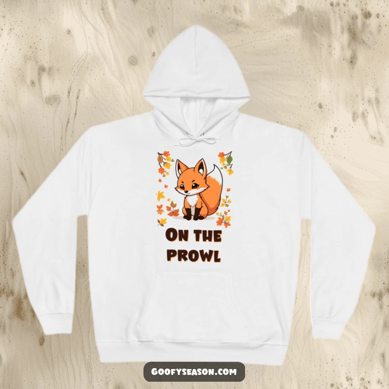 Funny fox hoodie featuring a determined fox with a swishing tail among colorful autumn leaves, perfect for cool weather comfort.