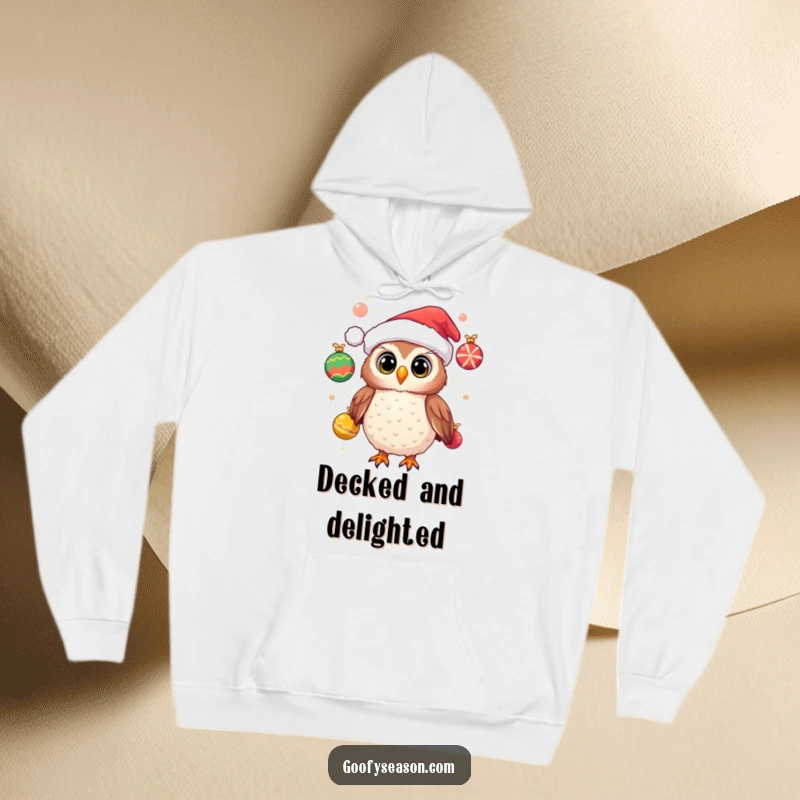 Funny hoodie featuring a cheerful owl wearing a Santa hat and juggling festive ornaments, offering cozy holiday comfort and festive cheer.