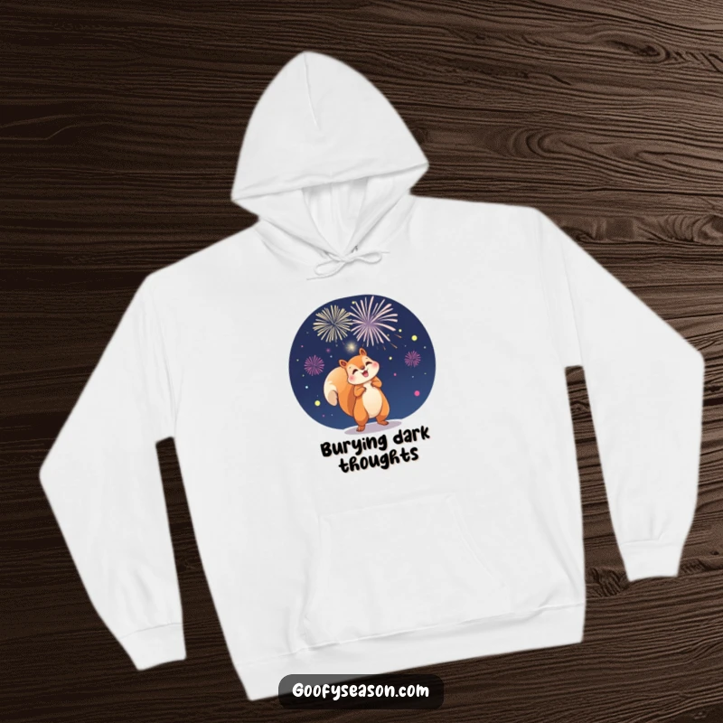 Funny, warm hoodie showing a playful squirrel launching vibrant fireworks against a dark night sky, full of energy.