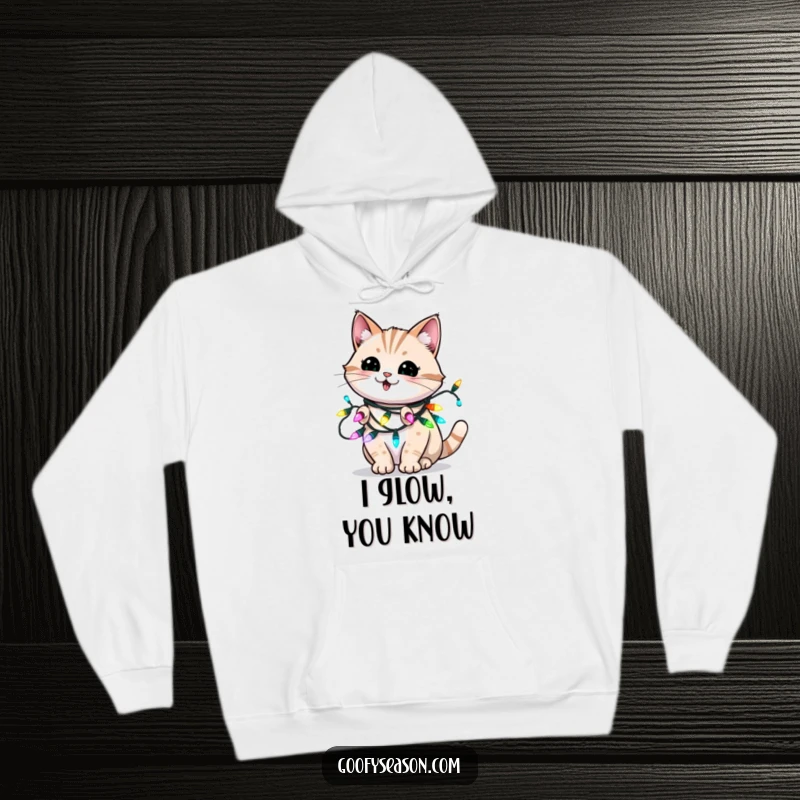 Funny hoodie depicting an energetic cat blinking playfully while wrapped in colorful, glowing holiday lights.
