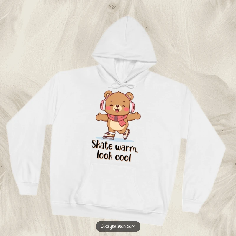 Funny bear wearing earmuffs, ice skating enthusiastically, providing warmth and humor in this cozy hoodie.