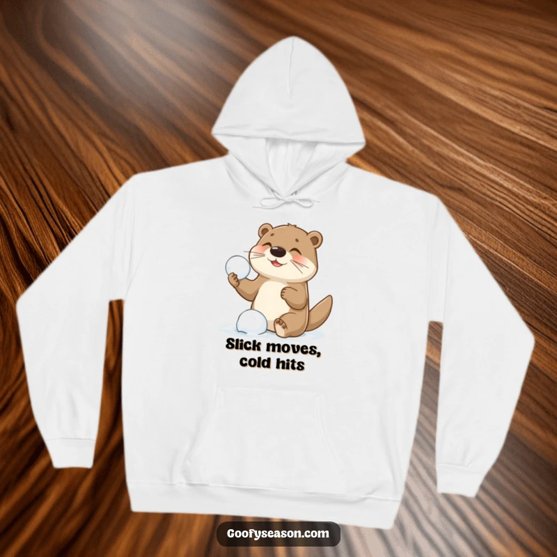 Funny hoodie depicting a playful otter character launching snowballs during an epic snowball fight, exuding winter excitement and joy.