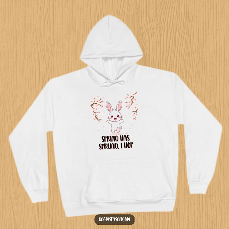 Funny cheerful bunny hopping amidst falling cherry blossoms, cozy spring hoodie, cute character.