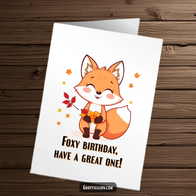 Funny Free Printable Birthday card shows a cheerful fox happily holding a vibrant bouquet of colorful autumn leaves for the season.