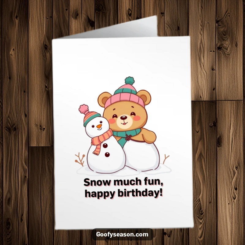 Funny Free Printable Birthday Card: Curious bear with mismatched hats builds a snowman, ready for winter laughs.