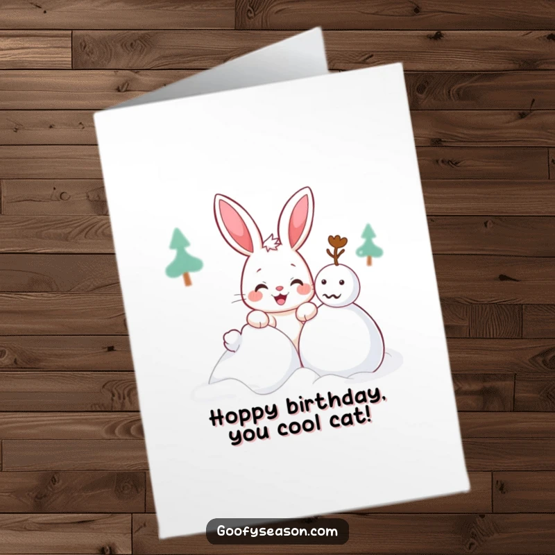 Funny Free Printable Birthday Card: Kawaii bunny with a mischievous grin attempts to build a snowman, ready for winter fun.