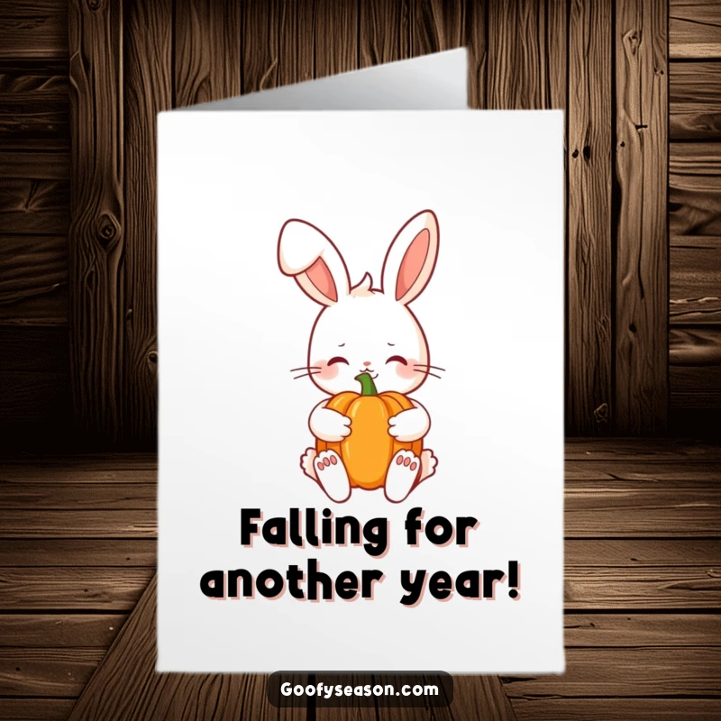Funny Free Printable Birthday Card: Shy Kawaii bunny holding a pumpkin with a sweet smile, perfect for autumn birthdays.