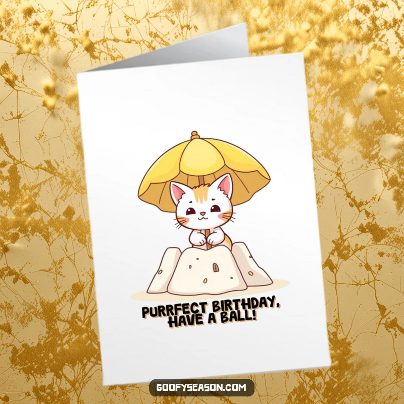 Funny Free Printable Birthday card shows a curious cat relaxing with a sun umbrella next to a magnificent sandcastle on the beach.