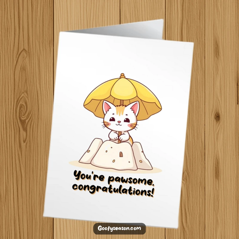 Funny Free Printable Congratulations card shows a curious cat enjoying a sun umbrella beside a beach sandcastle, celebrating a win.