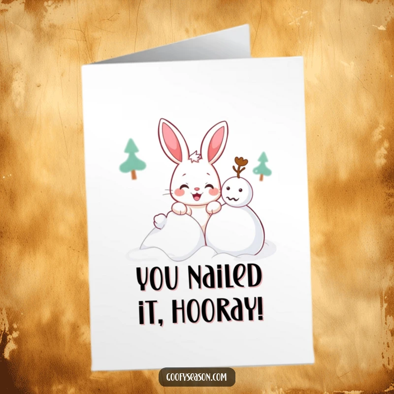 Funny Free Printable Congrats Card: A kawaii bunny with a sly grin playing in the snow, building a snowman.