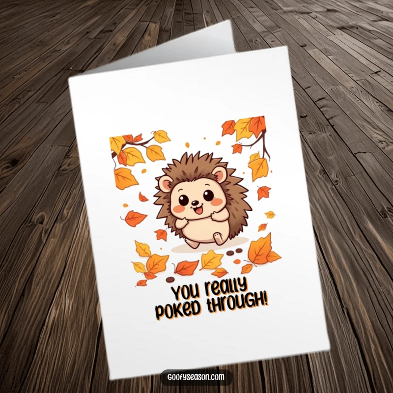 Funny free printable congratulations card showing a delightful hedgehog playfully stumbling through a thick carpet of fallen autumn leaves.
