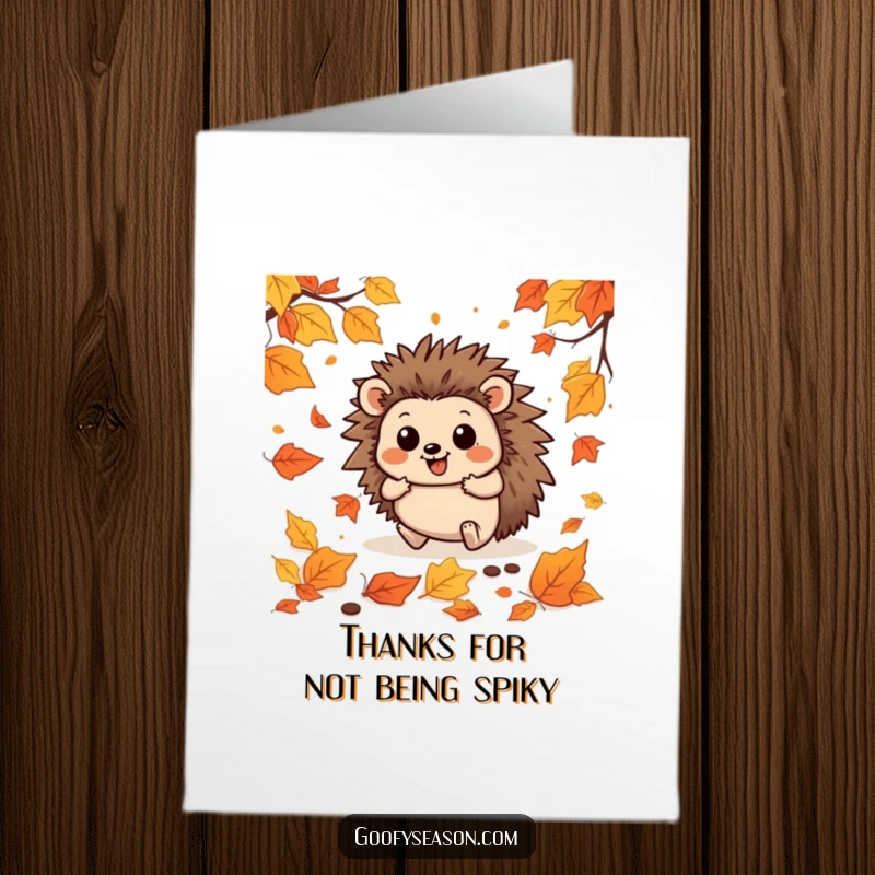 Funny free printable thank you card of a happy hedgehog comically falling amidst a vibrant collection of autumn leaves.
