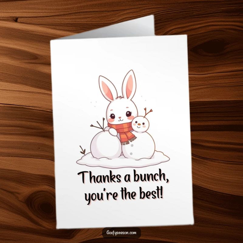 Funny Free Printable Thank You Card: A curious bunny in a scarf attentively builds a snowman, adding finishing touches.