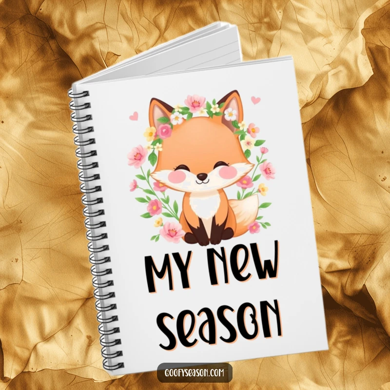 Funny notebook with a happy fox wearing a spring wreath, surrounded by blooming flowers, designed for capturing spring inspirations.