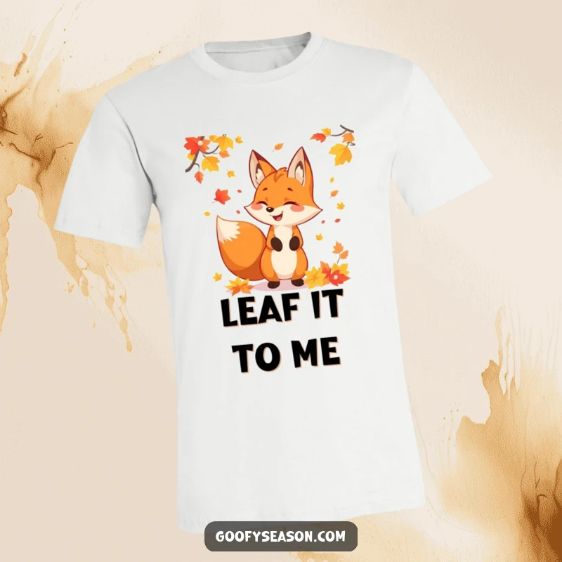 Playful fox character juggling a pile of colorful autumn leaves, depicted on a fun t-shirt for fall enthusiasts.