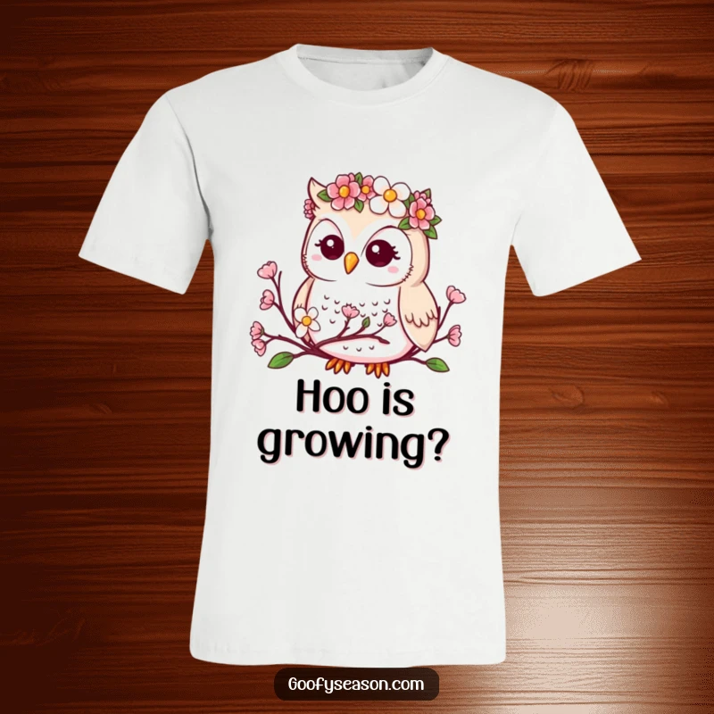 Funny t-shirt featuring a cute kawaii owl in a flower crown observing delicate spring buds and blossoms.