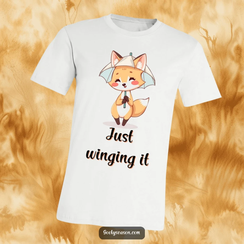 Funny T-Shirt: A smiling fox performs a happy rain dance under a miniature umbrella, capturing pure joy.