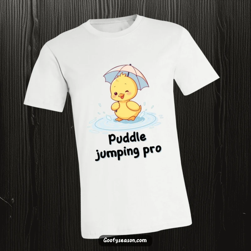 Funny t-shirt with a happy duckling in a tiny umbrella, gleefully splashing in a rain puddle.