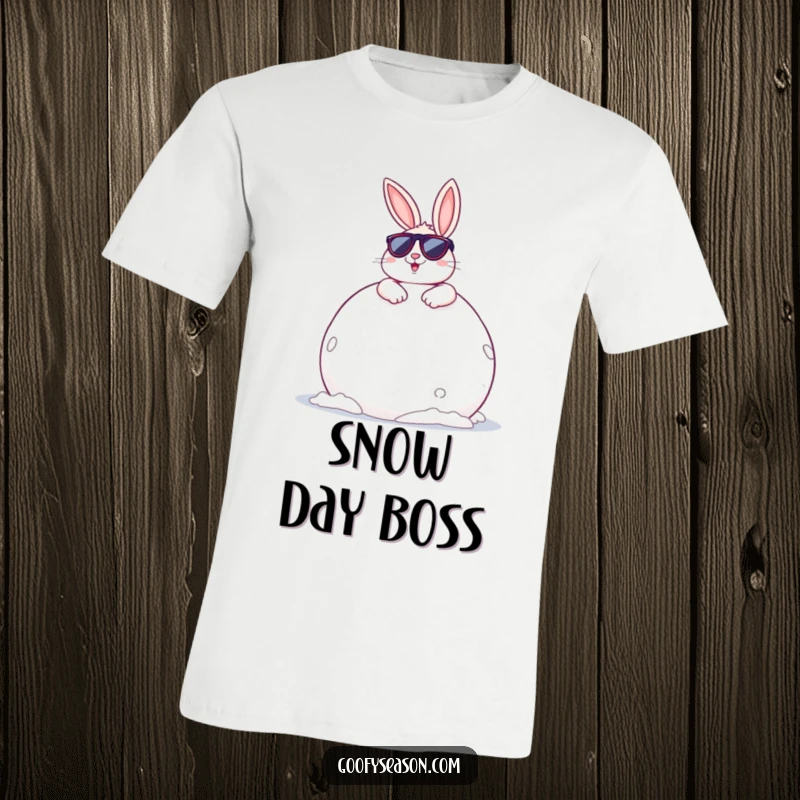 Funny Bunny T-Shirt: A cheerful bunny with sunglasses lounging on a huge snowball, exuding cool winter vibes.