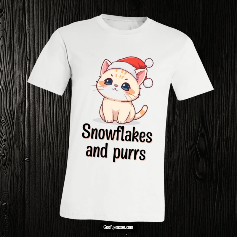 Funny t-shirt featuring a cute Kawaii cat in a Santa hat catching snowflakes, ideal for holiday fun.