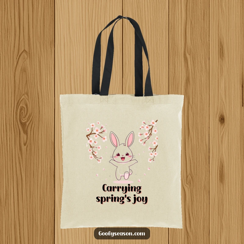 Funny happy bunny hopping through falling pink cherry blossoms on a tote bag, spring accessory.