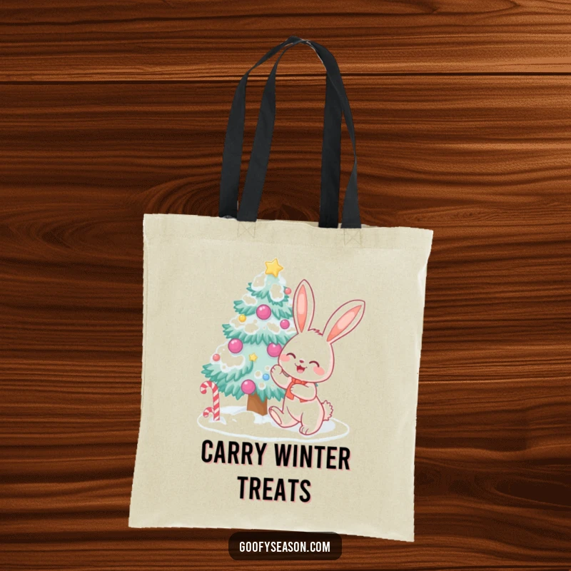 Happy bunny character decorating a snow-covered tree with candy, designed on a practical tote bag for holiday essentials.