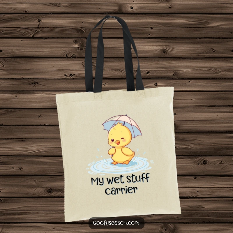 Funny tote bag showing a happy duckling with a tiny umbrella, splashing gleefully in a puddle.