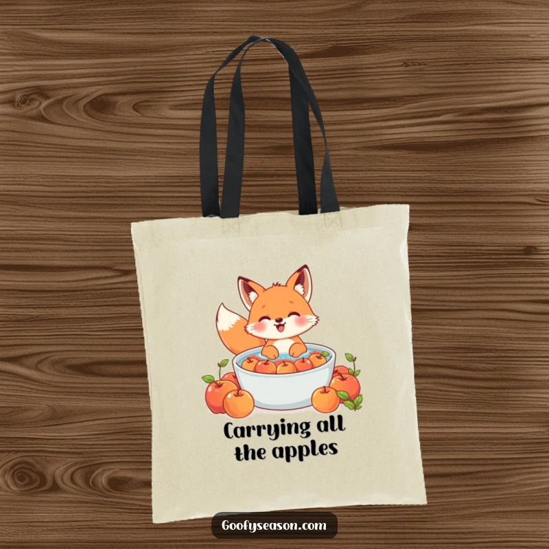 Funny Kawaii fox tote bag with a cute character gleefully bobbing for apples in a large tub, stylish and practical.