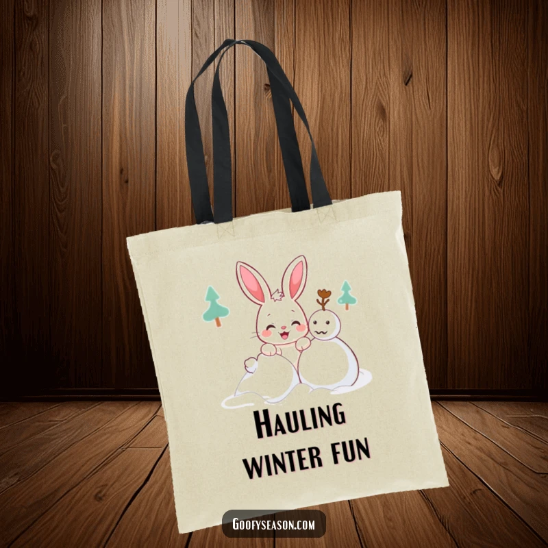 Funny Kawaii bunny tote bag with a cute character with a mischievous grin building a snowman, stylish for winter.